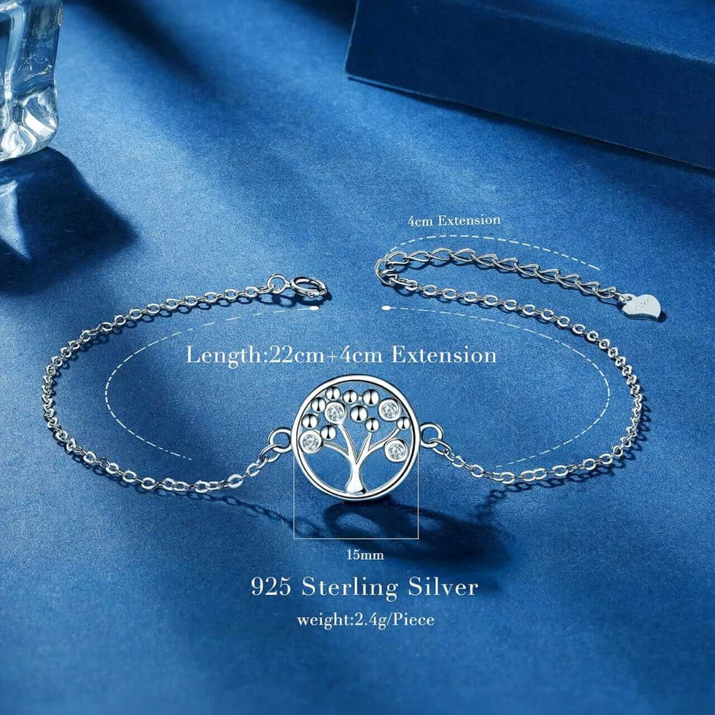 Sterling silver tree of life bracelet with adjustable chain and clasp, displayed on a blue textured background with measurement annotations.