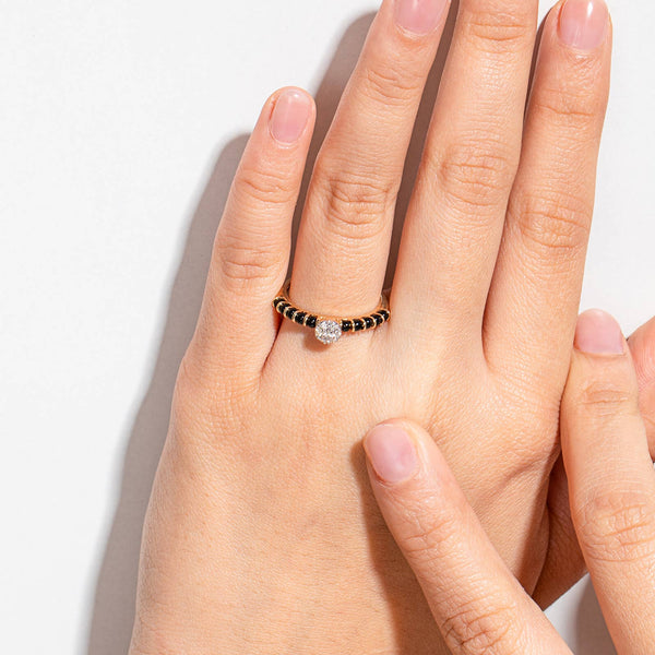 Elegant Simple Mangalsutra Ring in 92.5 silver with a cluster of American diamonds and traditional black beads.