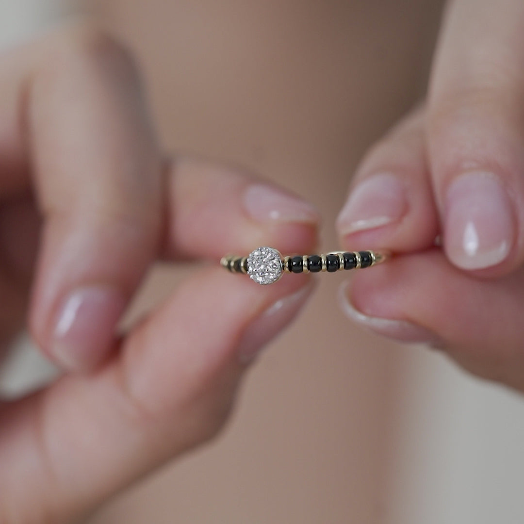 Elegant Simple Mangalsutra Ring in 92.5 silver with a cluster of American diamonds and traditional black beads.
